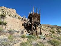 Scenic Drive in the Mojave Desert with Mines, Blooming Plants and Relics.