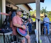 Strumming George on the Deck