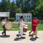 Parade of musicians around the village common during Independence Day Celebration