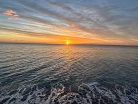 Walk at Sunrise beside the Ocean